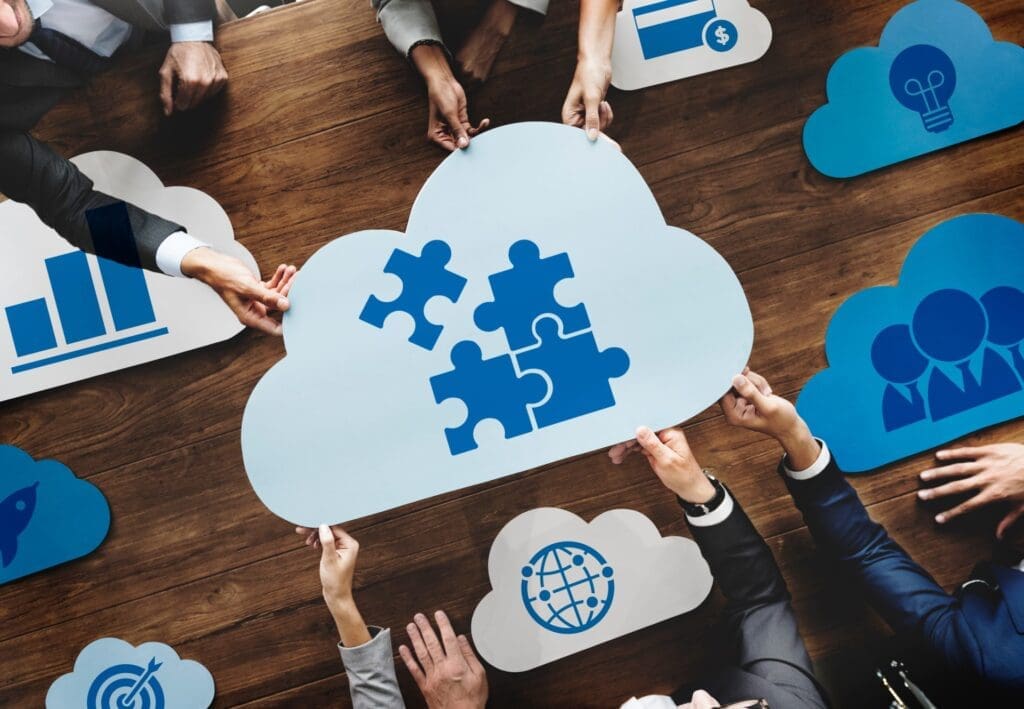 People holding jigsaw inside a cloud. 